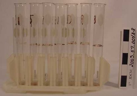 Two Test Tube Sets In White Pl