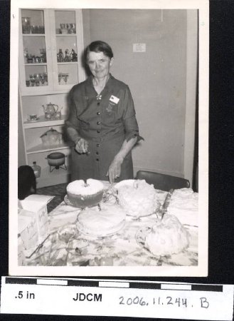 Erma Olson cutting cakes