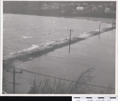 Waves breaking over Bureau of Mines Causeway 11-18-1961
