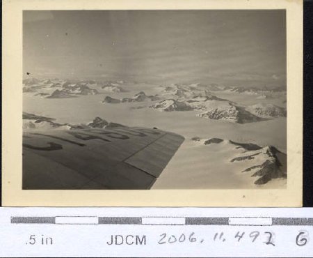 Aerial view Juneau Ice Field with plane wing 1986-88