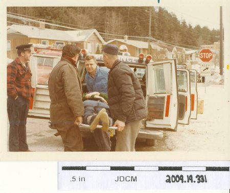 color, loading person into ambulance