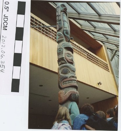 Children with an indoor totem pole