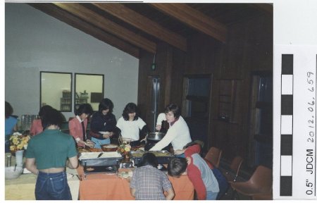 Youth Center Director Kim Kiefer serving Thank Dinner, 1984