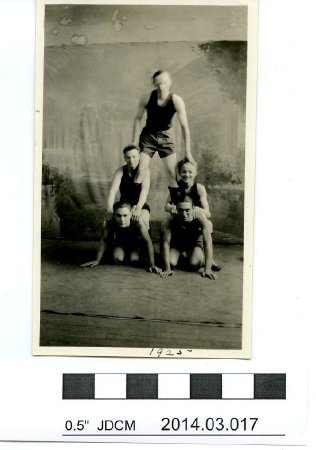 1925 Photograph of 5 boys standing/kneeling on each other in a pyramid