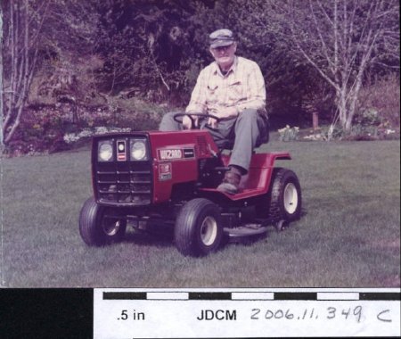Carl Jensen on riding lawn mover 1984