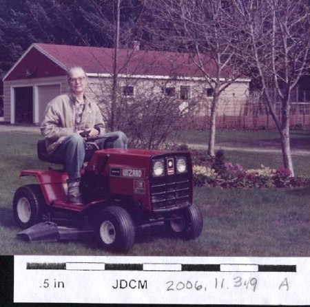 Caroline Jensen on riding mower 1984