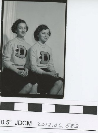 Two high school cheer leaders