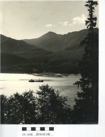 B&W photograph of a boat on the channel