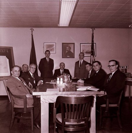 Men around table