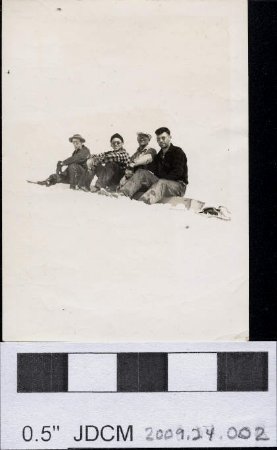 Jesse Taylor, Melvin, Chuck Jacobsen & Fritz sitting on a crossarm