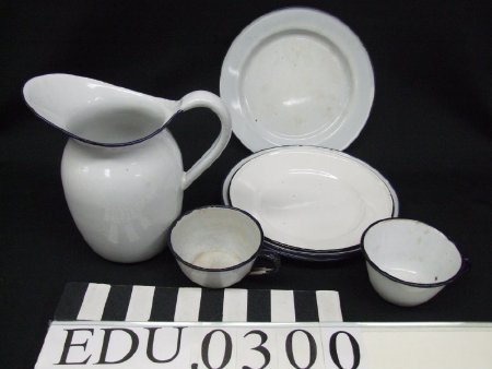 White enamelware dishes and pitcher