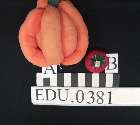 Toy stuffed pumpkin and tomato